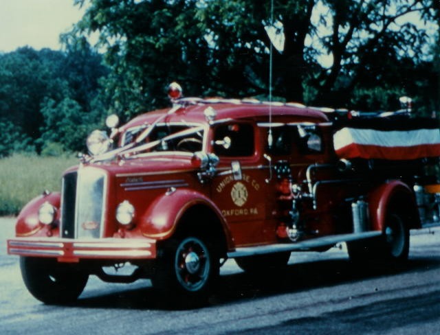 The 1948 505 Mack pumper in a parade.