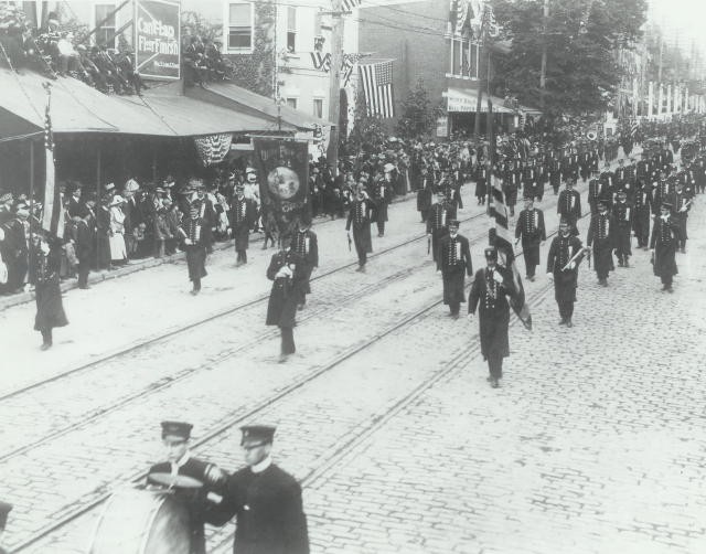 The membership marching in a 1912 parade.