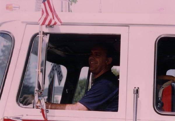 Rich Bachman driving Engine 21-1 in a parade.