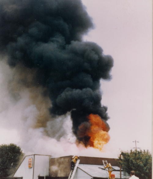 Fire erupts from the roof of the Burger King on North 3rd Street.