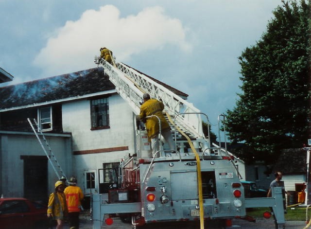 Jack Simpson operates the turntable of Ladder 21 at the former Barr & Smith Motors (now Country Chrysler) on Baltimore Pike.