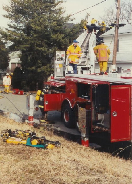 Firefighter Dave Vining manning the turntable of Ladder 21 at House Fire on Commerce Street.