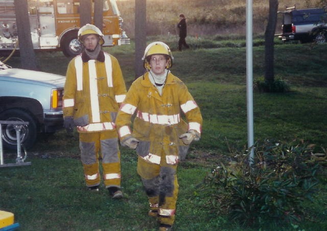 Firefighter Dobson Greer and Bud Charlton at a West Grove House Fire in 1991.