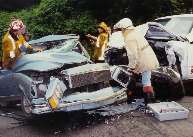 (L-R) Rescue Captain Dave Terry, Firefighter Brian Carter, and Chief Chuck Deaver operating on an MVC with entrapment on Route 472 in Colerain Township, Lancaster County in 1991.