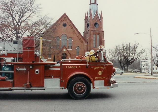 Fire Chief Chuck Deaver and Firefighter Percy Reynolds in Ladder 21 heading northbound on North Third Street.