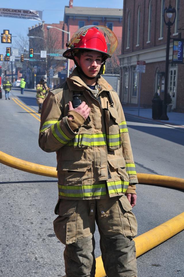 Junior Firefighter Kyle Griffin on South Third Street.