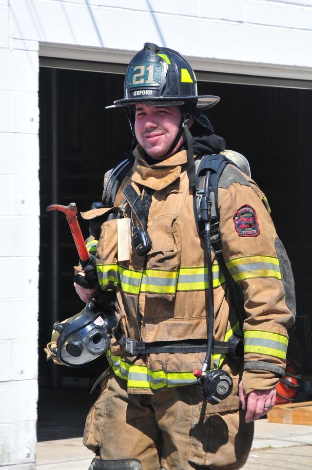 Firefighter Wayne Worthington smiles as he goes to his next assignment.