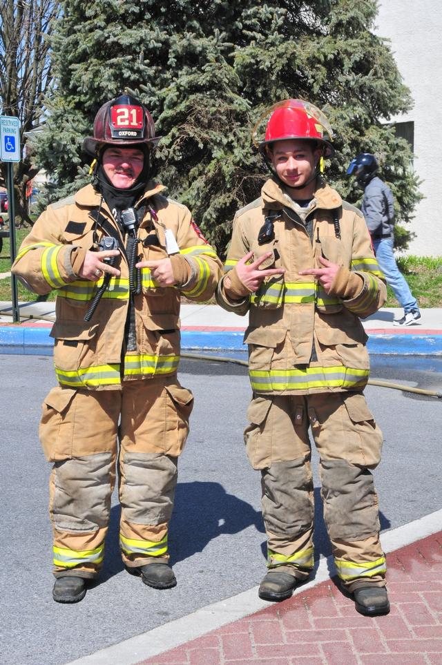 Firefighter Frank Hersh and Junior Firefighter Kyle Griffin showing some &quot;21&quot; love.