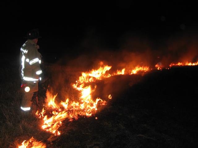 Hoseman Brian Slauch at brush fire in Wyncote.