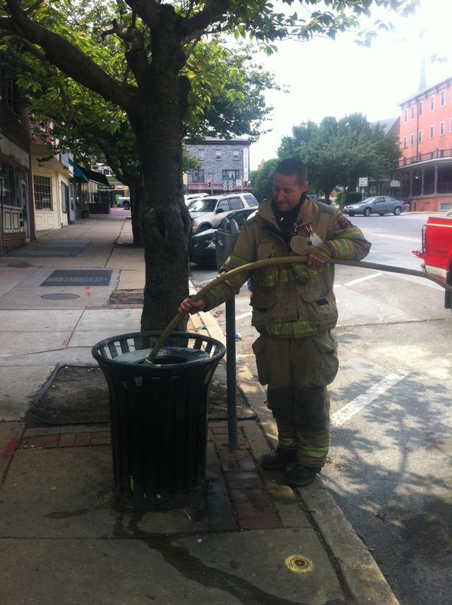 Firefighter Matt Woolston makin' the hit on a Market Street blaze.