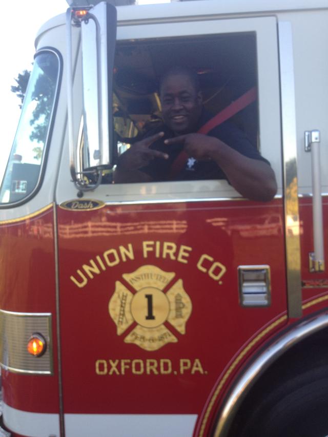 Firefighter Tim Greene showing some &quot;21&quot; love while wheelin' Engine 1.
