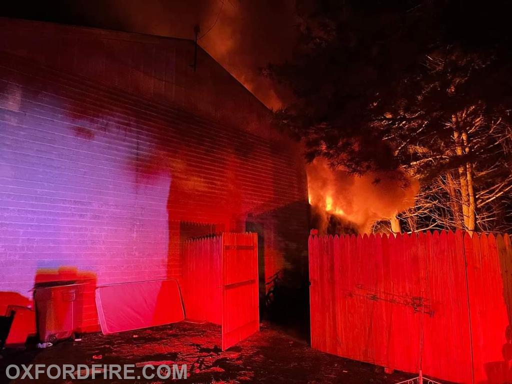 Fire visible from the rear of the structure. 